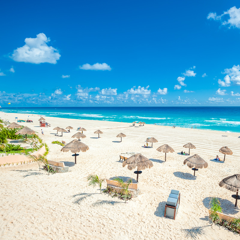 empty beach with sun loungers