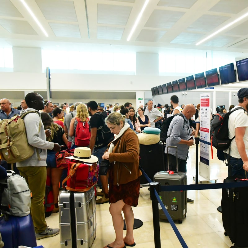 passengers in queue at cancun airport