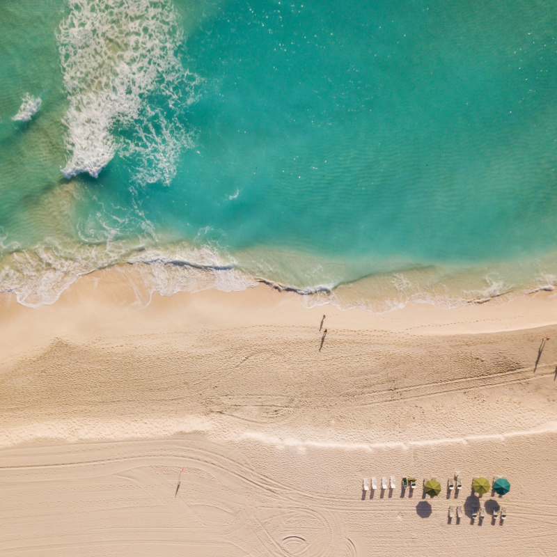 drone view of practically empty beach in Cancun.