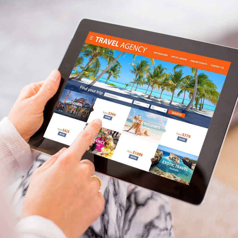 Traveler purchasing a tour package on a tablet