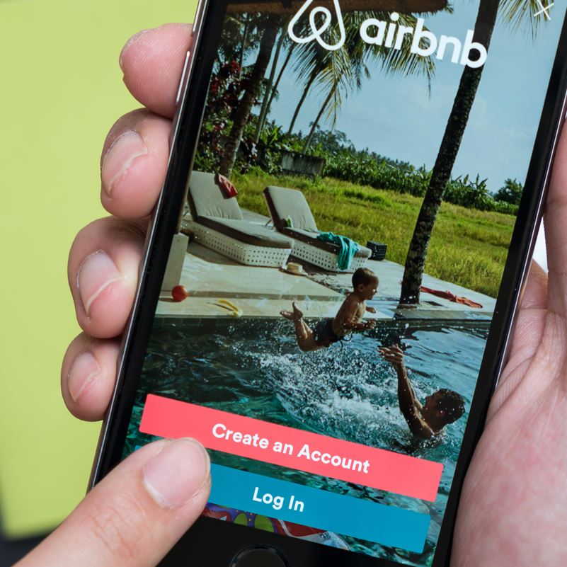 Person Using Airbnb App, mexican caribbean