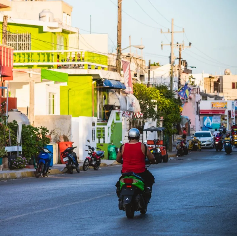 man riding moped