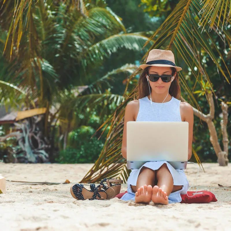 digital nomad on beach