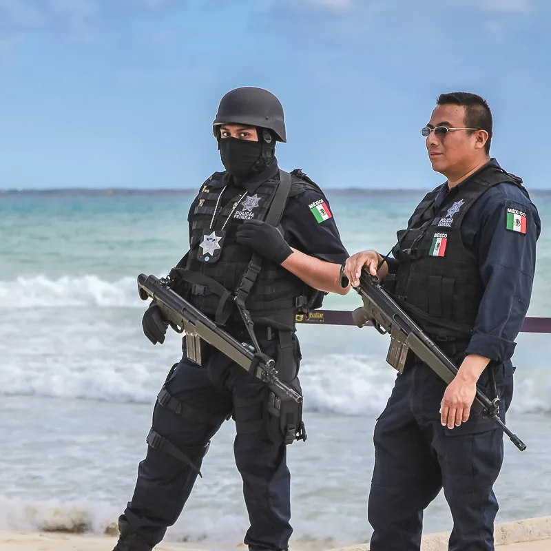 Armed Police Officers on a Mexican Beach