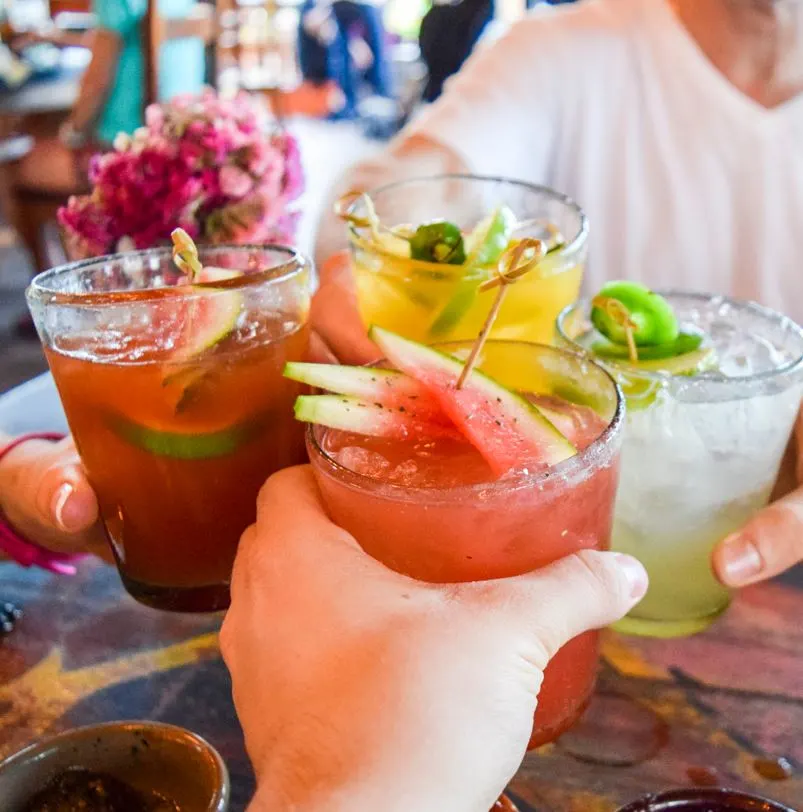 Tourists Having Drinks at a Cancun Resort Restaurant