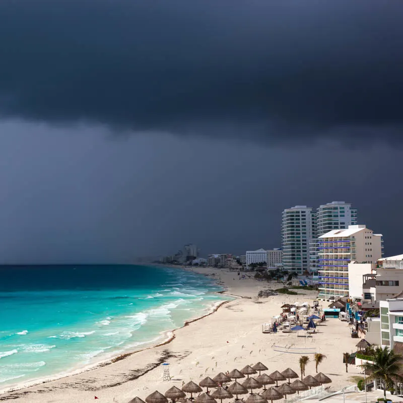 hurricane over cancun and dark clouds 