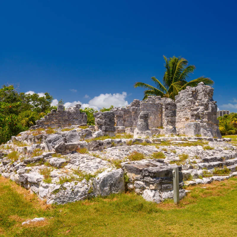 Ancient Mayan ruins in Cancun with blue skies 