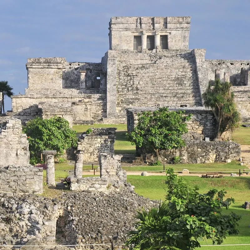 palenque ruins against blue sky