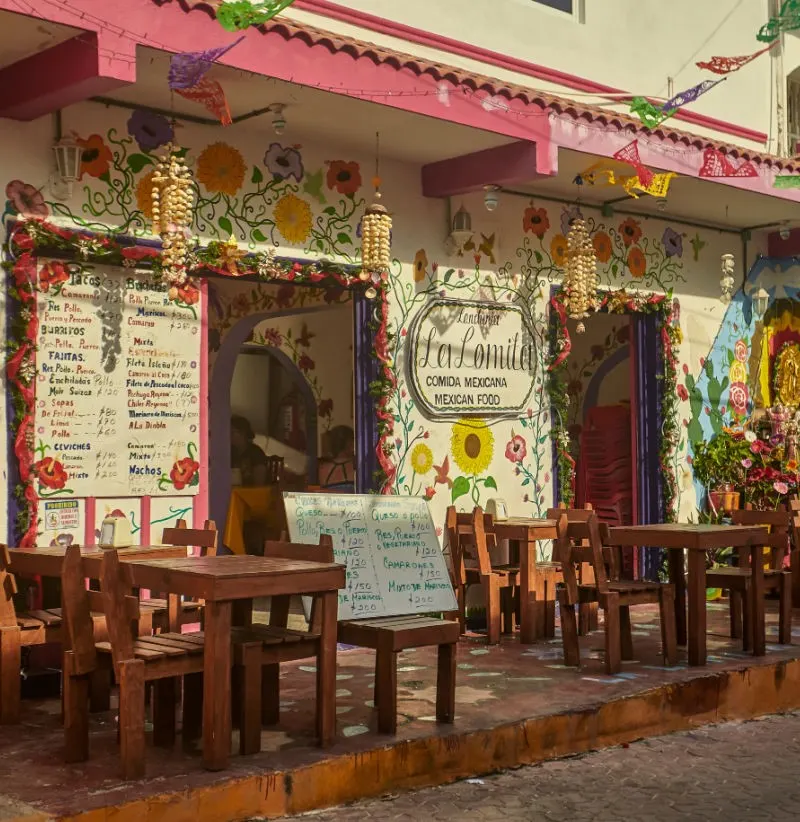 Mexican Restaurant Isla Mujeres, Mexico with tables and chairs outdoors.