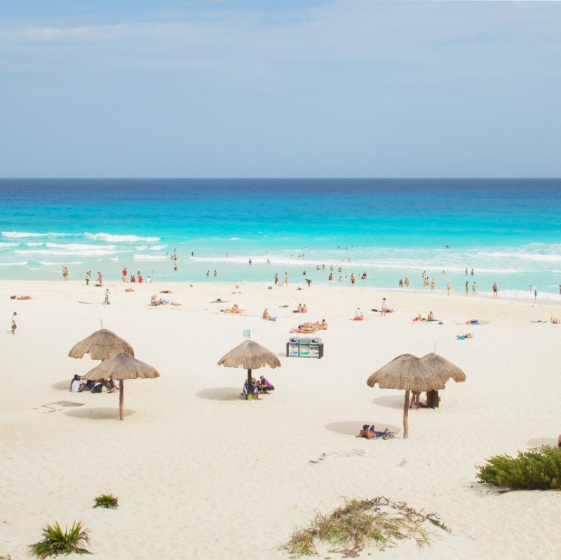 Tourists at Playa Delfines