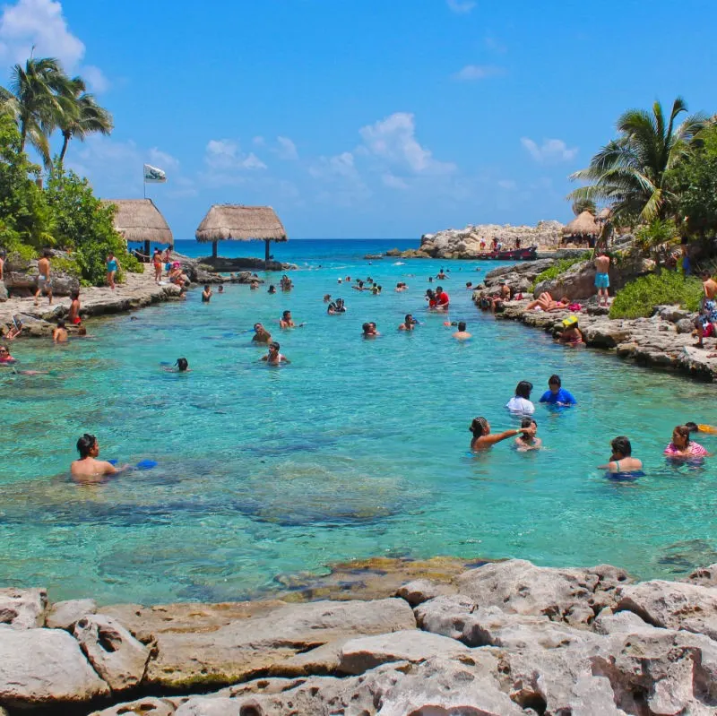 Xcaret Park with tourists swimming in the water