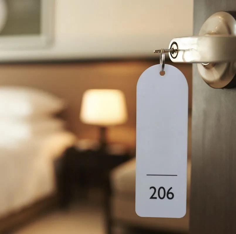 a hotel room key in its housing with the door open