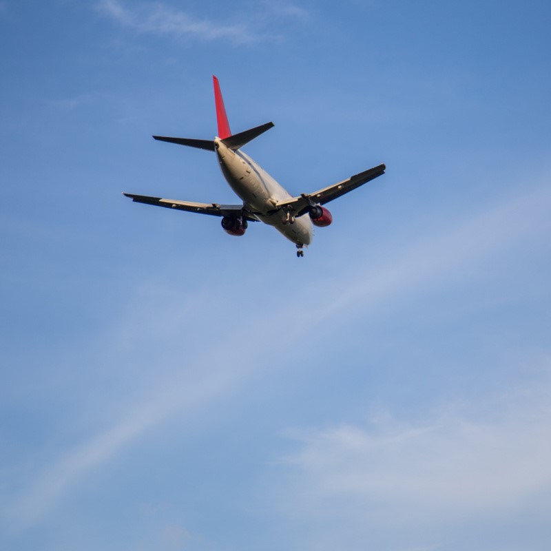 Airplane Landing in the sky getting ready to land in Cancun at Cancun International Airport.