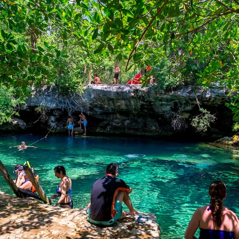 Beautiful mexican Cenote Cristalino with turquoise water and jungle plants