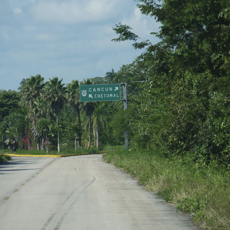 Directional road sign Cancun and Chetumal