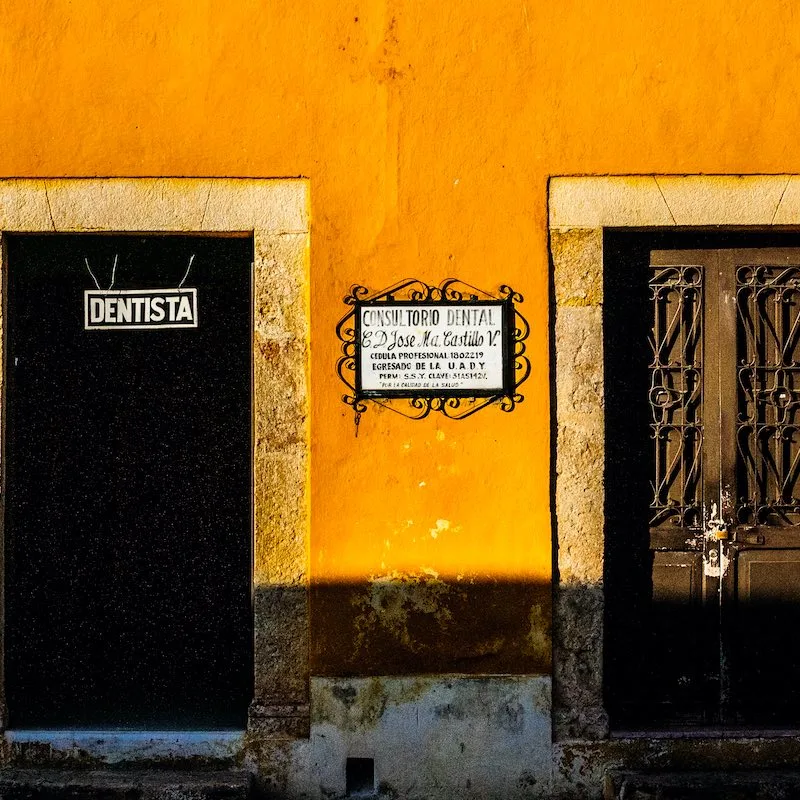 Yellow streets facades of Izamal, called the "Yellow city", with colonial doors of retail shops and businesses