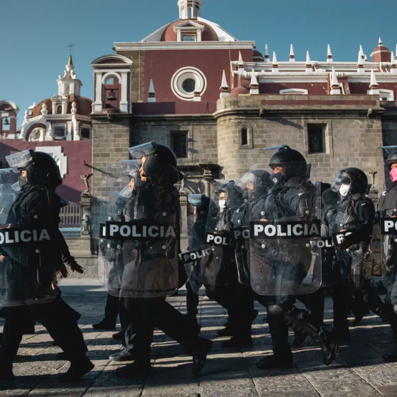 Mexican Police with Shields Walking Down the Street