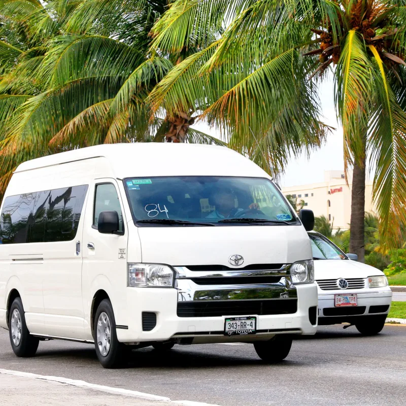 Taxi van taking tourists to the beach