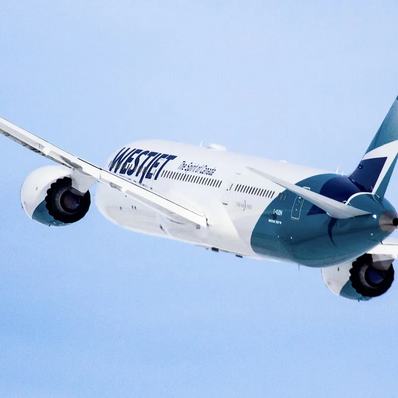 WestJet airplane in flight from Canada