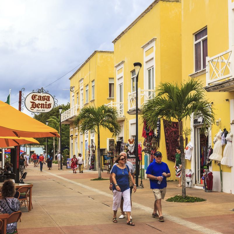 brightly colored building on a pedestrian street in San Miguel, Cozumel