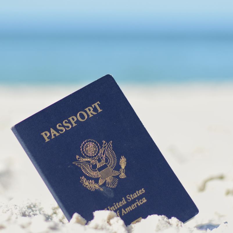 USA Passport on a beach in the sand