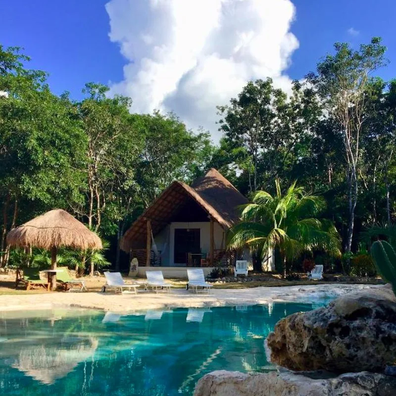 view of two bedroom villa and outdoor pool at Villa Morena Hotel Boutique Ecoliving in Akumal, Mexico.