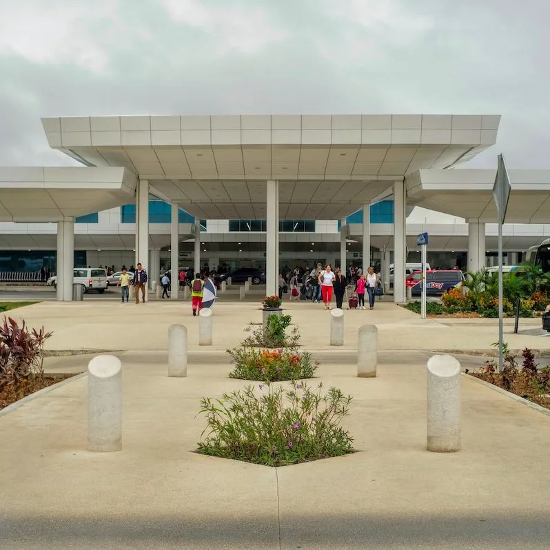 exterior of terminal at Cancun International Airport during the day.