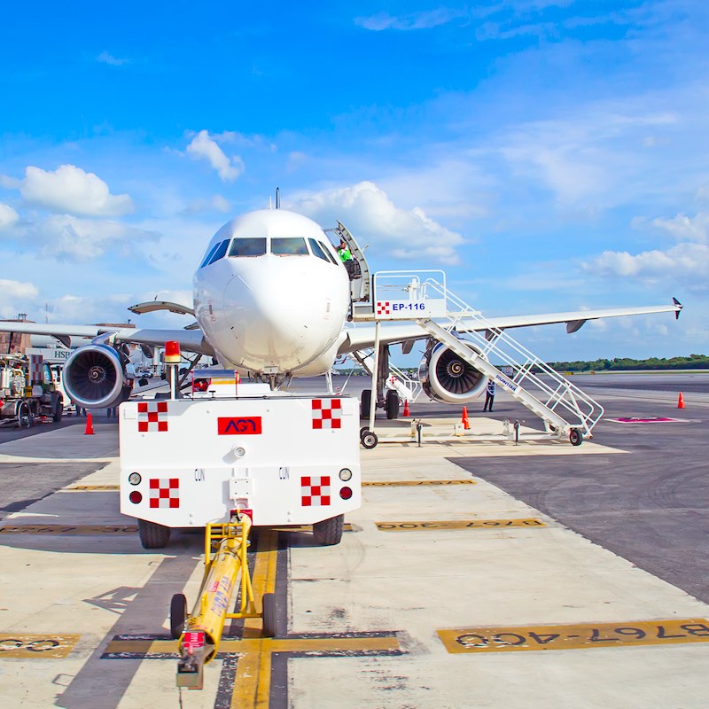 Airplane at the gates of Cancun International Airport outside