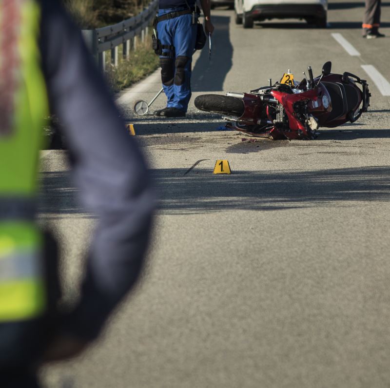 red sport motorcycle crash on road