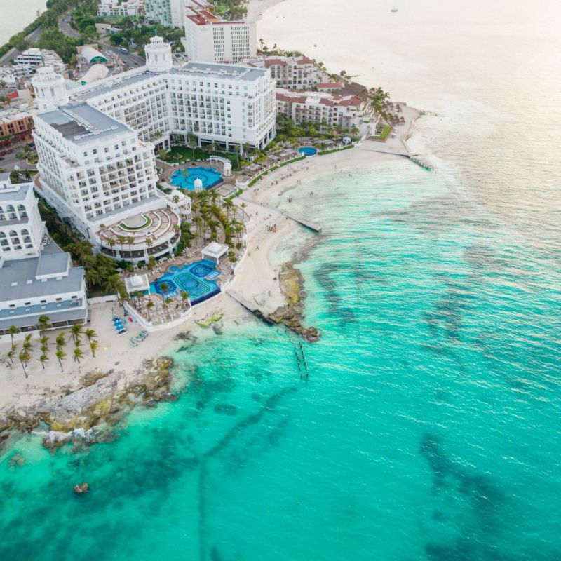Aerial panoramic view of Cancun beach and city hotel zone in Mexico on the carribean sea coastline. showing clear turquoise water on a beautiful sunny day
