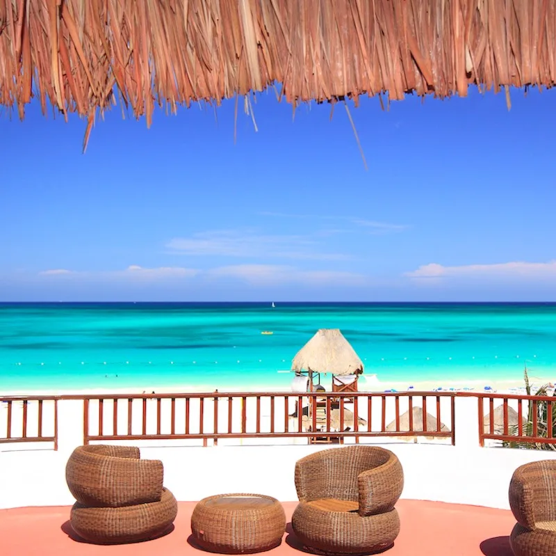 Tourist resort balcony overlooking a stunning tropical beach