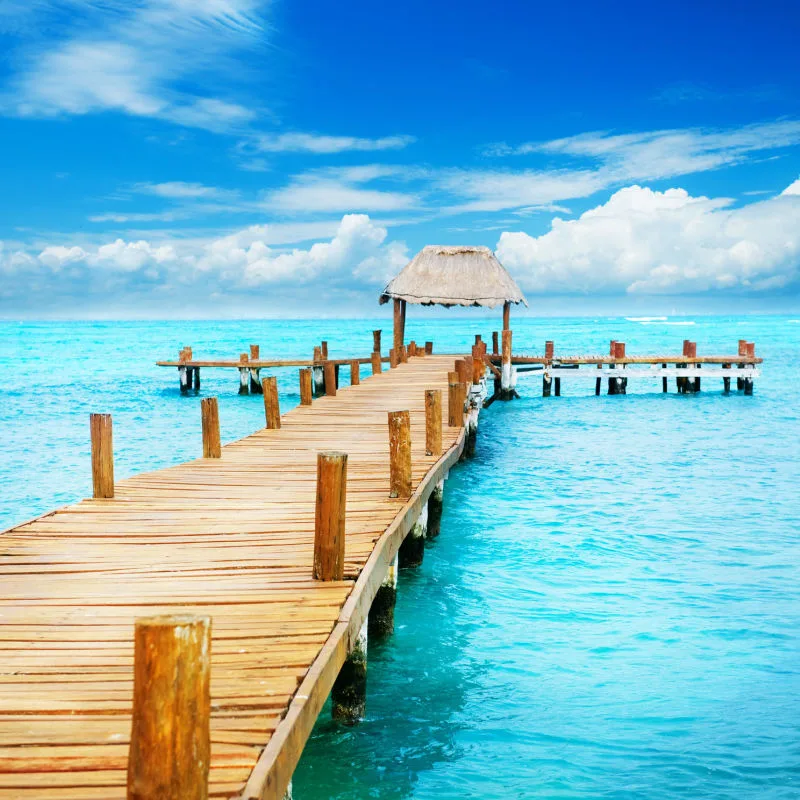 Stunning blue water and wood pier in bacalar mexico