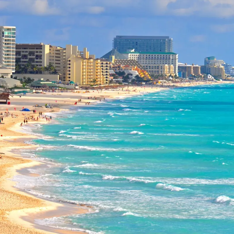 Cancun's Beautiful Caribbean Sea and Beaches Filled with Tourists.
