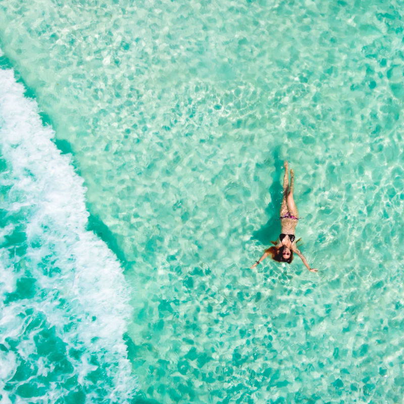 Woman floating in Mexican Caribbean Sea