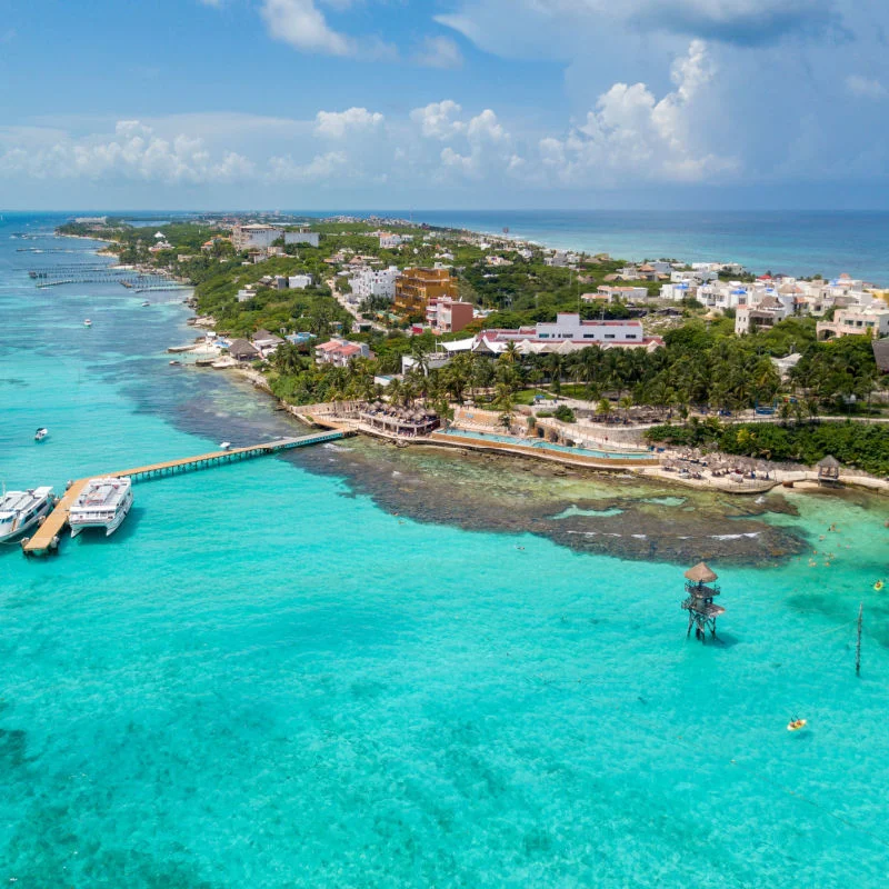 Isla Mujeres' stunning tropical water and buildings aerial view