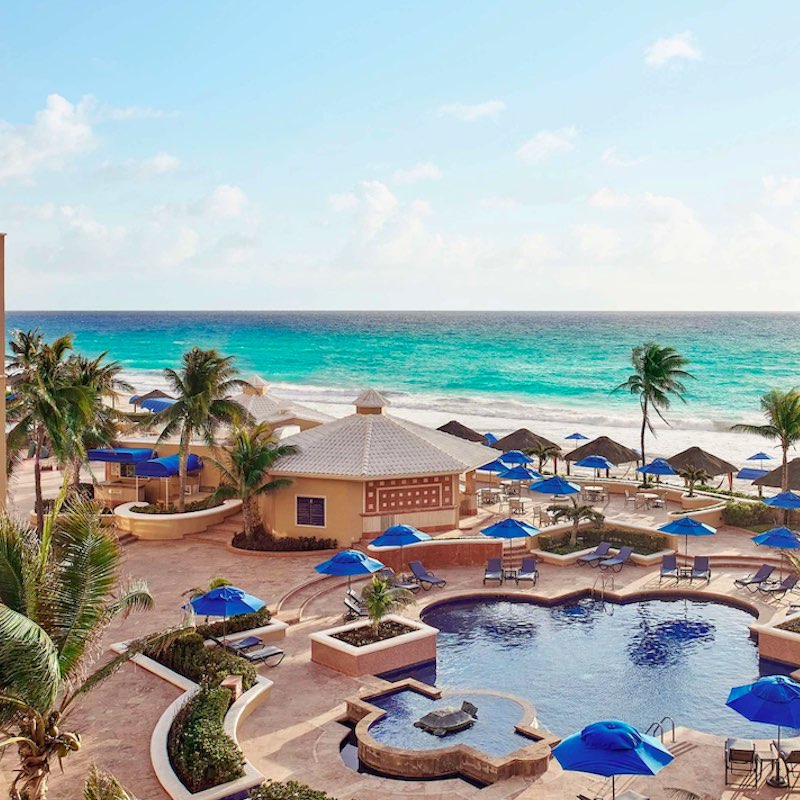 aerial view of the pool and cabanas with a view of the Caribbean Sea at the Kempinski Hotel Cancun in the Hotel Zone.