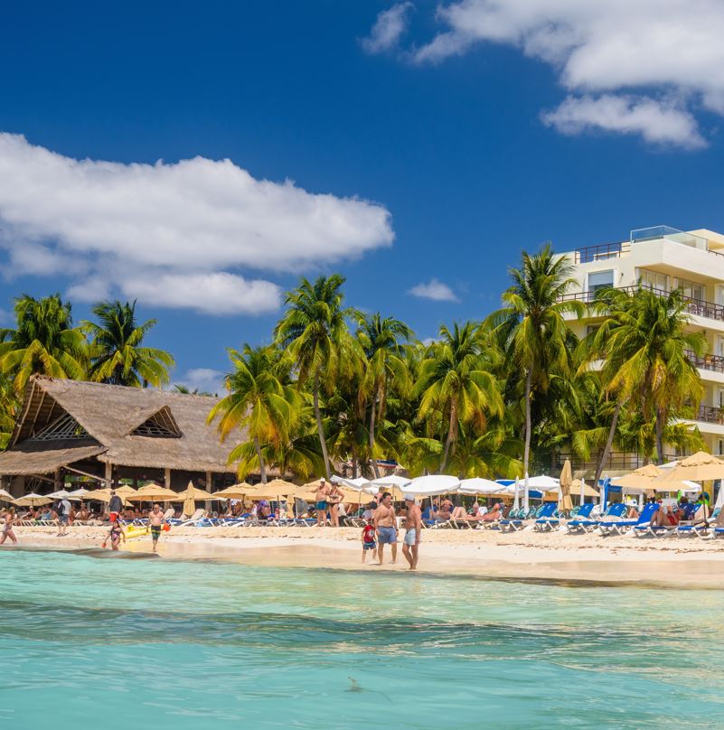 People walking on beach in Isla Mujeres