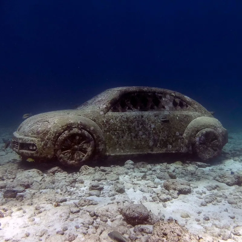 Sculpture of a car at the Underwater Museum of Art in Isla Mujeres, Mexico.