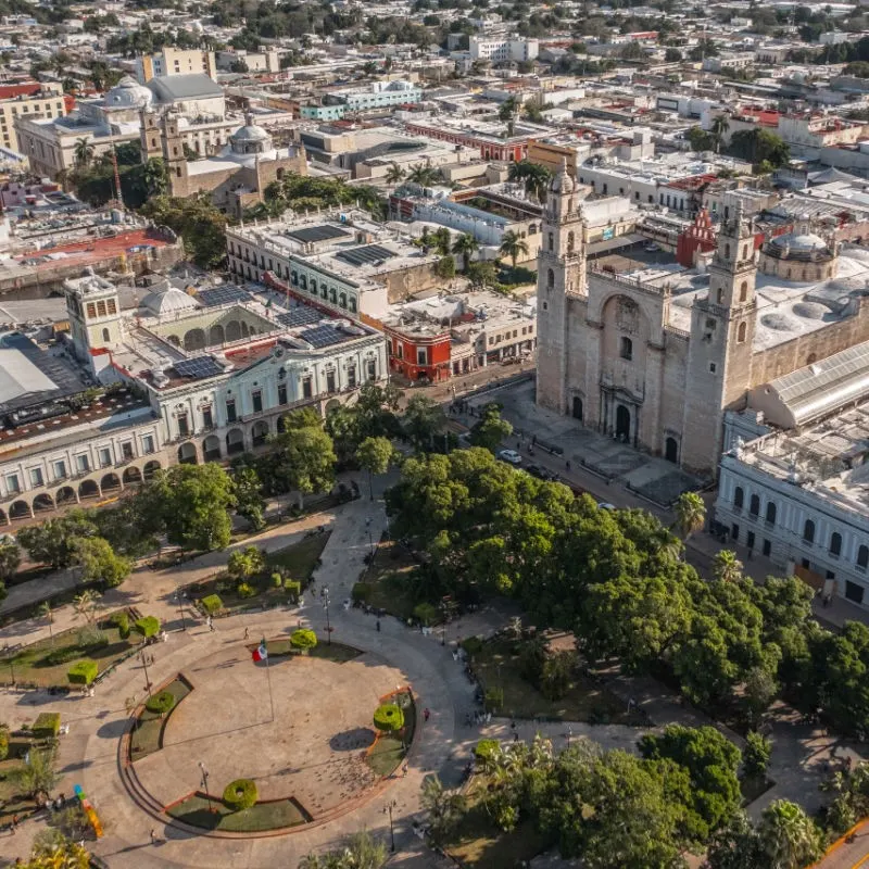 Aerial View of Merida with a plaza and buildings in the background.