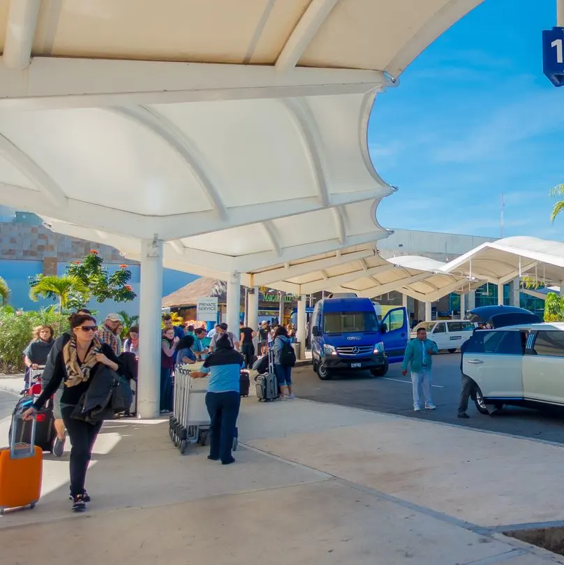 Visitors leaving cancun airport to get a taxi to go to their resorts and hotels