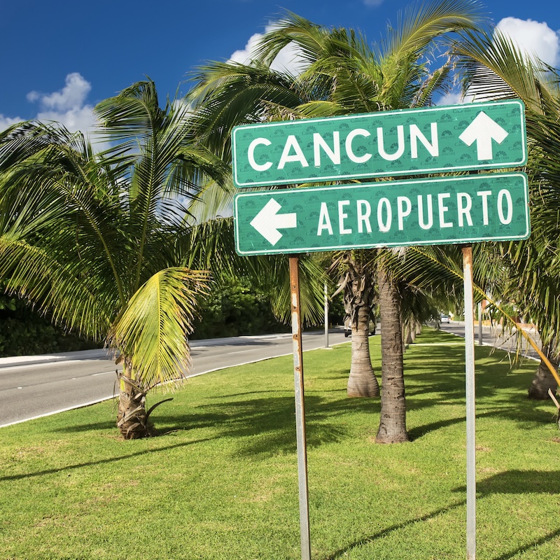 cancun airport road sign