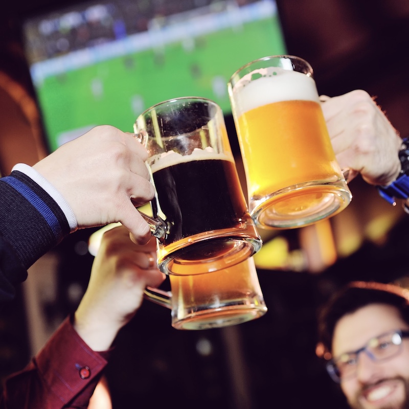 men cheers sports bar beers