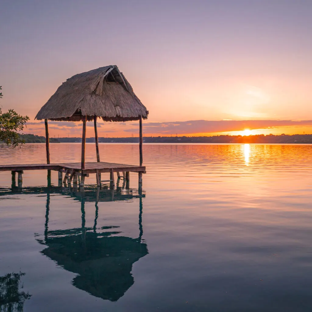 bacalar sunset with water walkway
