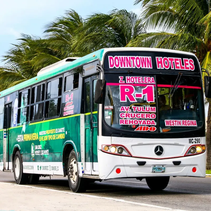 Bus Driving Down a Street in Cancun, Mexico