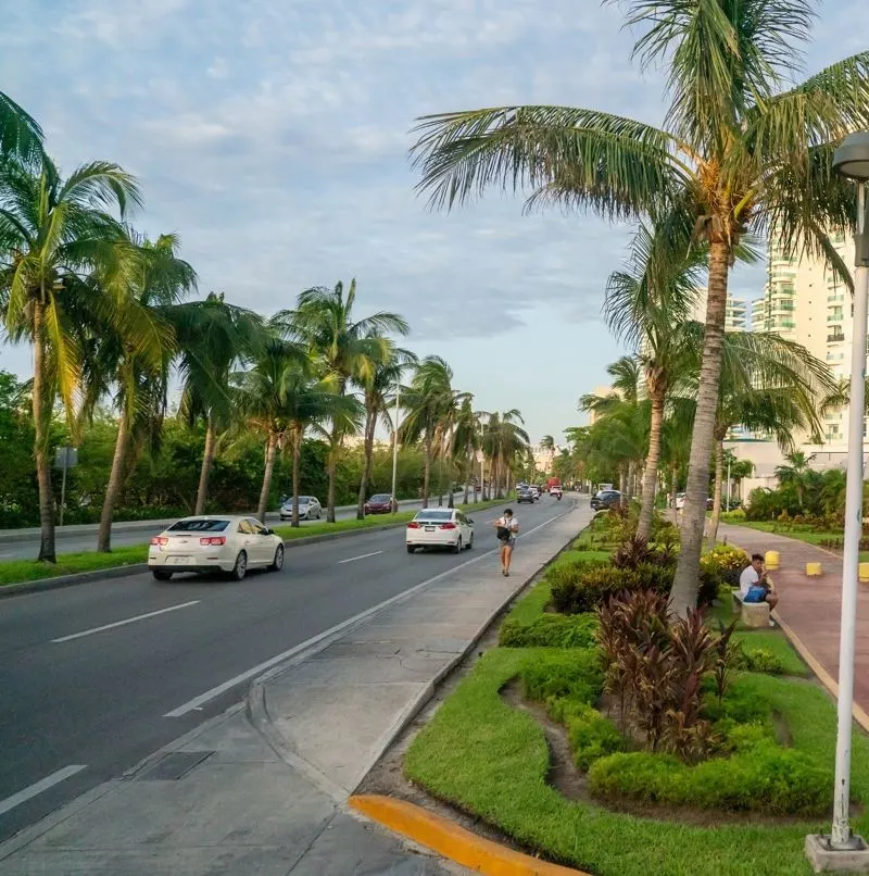 Cancun Hotel zone boulevard with cars driving down the road