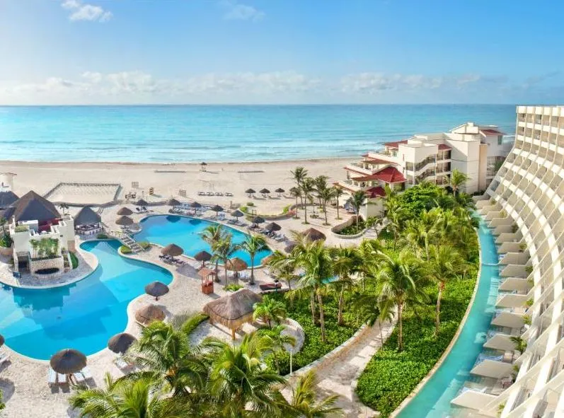 Grand Park Royal Cancun pool and property next to the Caribbean Sea.