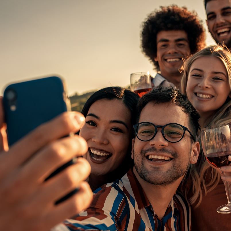 Group of people taking a selfie at a restaurant