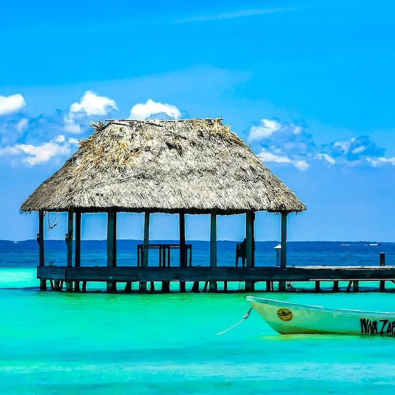 Panorama landscape view on beautiful Holbox island Punta Coco lagoon sandbank and beach with waves turquoise water and blue sky in Quintana Roo Mexico.