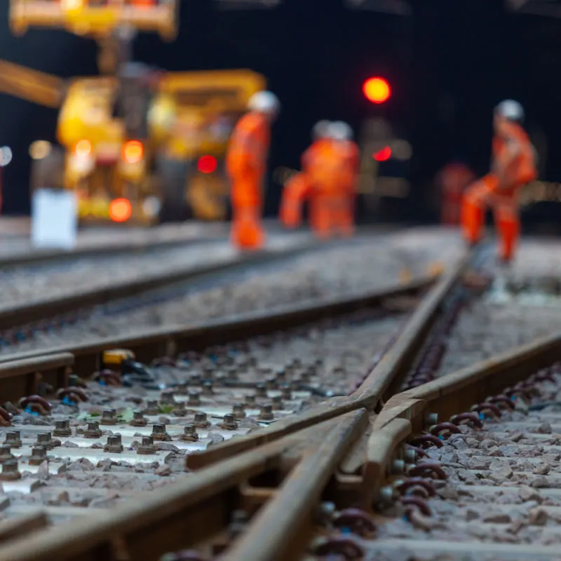 Workers building new train tracks 