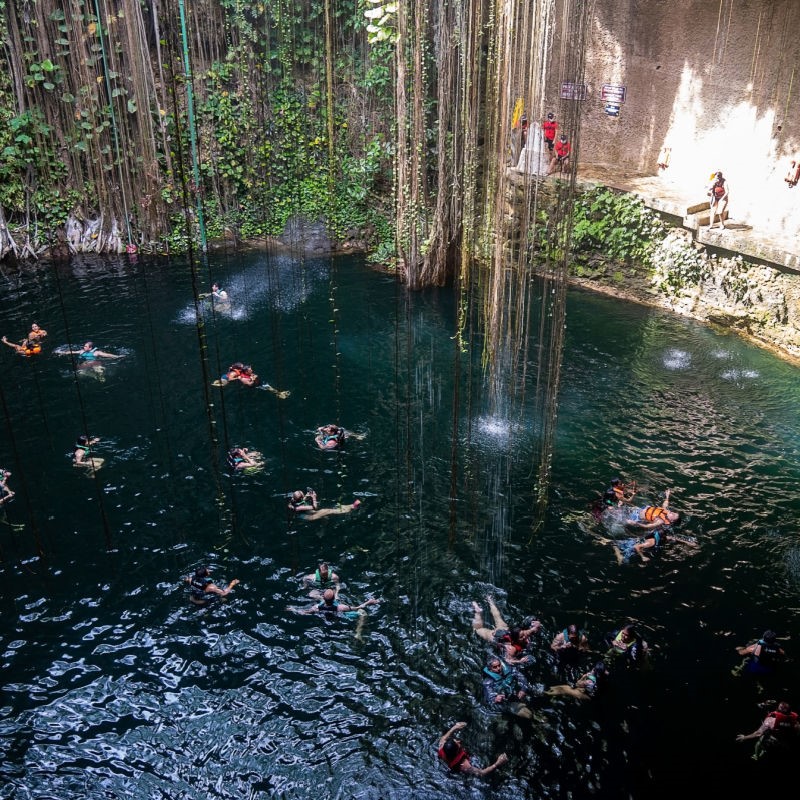 People Swimming in a Cenote Near Cancun, Mexico